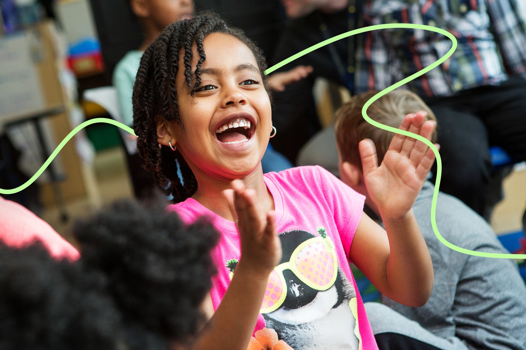 A young girl claps her hands and smiles joyfully; a line has been added for visual effect